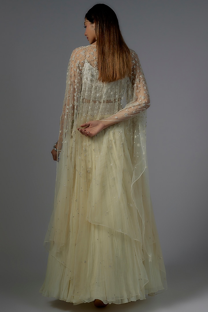 Ivory Net & Viscose Motif Embroidered Jacket Wedding Lehenga Set by COUTURE BY NIHARIKA at Pernia's Pop Up Shop
