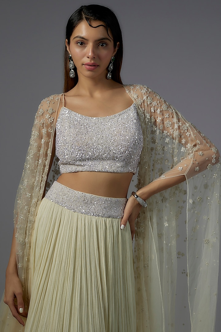 Ivory Net & Viscose Motif Embroidered Jacket Wedding Lehenga Set by COUTURE BY NIHARIKA at Pernia's Pop Up Shop