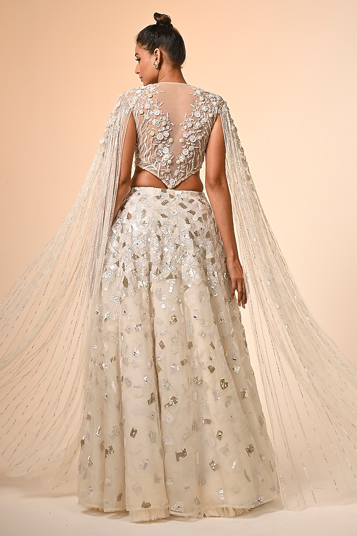 Ivory Net & Organza Hand Embroidered Bridal Lehenga Set by COUTURE BY NIHARIKA at Pernia's Pop Up Shop