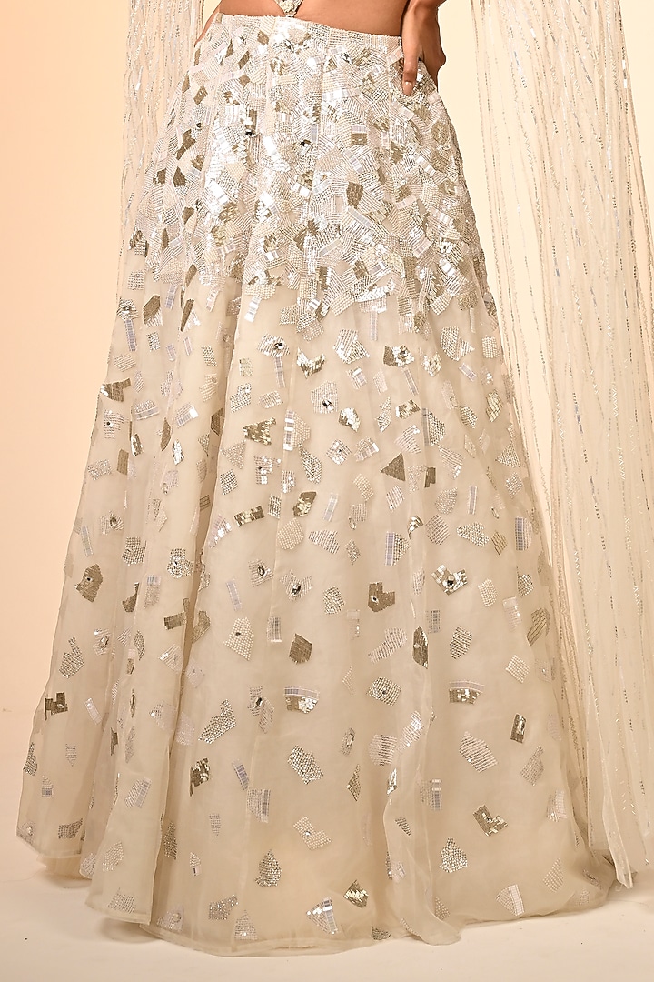 Ivory Net & Organza Hand Embroidered Bridal Lehenga Set by COUTURE BY NIHARIKA at Pernia's Pop Up Shop