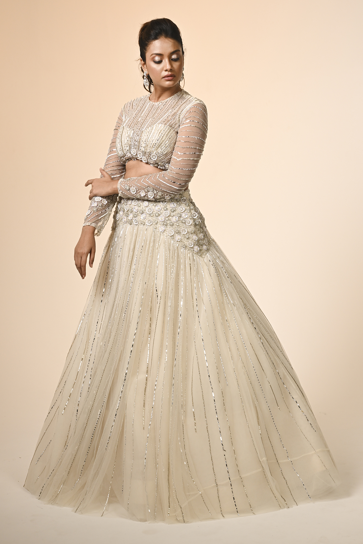 Ivory Net Floral Embroidered Wedding Lehenga Set by COUTURE BY NIHARIKA at Pernia's Pop Up Shop