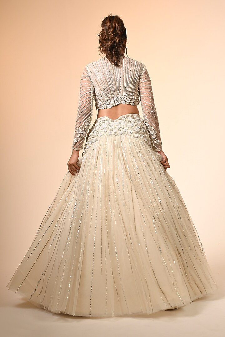 Ivory Net Floral Embroidered Wedding Lehenga Set by COUTURE BY NIHARIKA at Pernia's Pop Up Shop