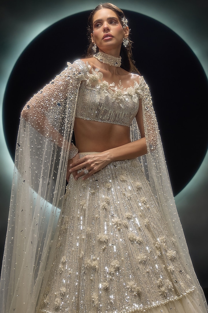 Ivory Taiban Net Hand Embroidered Bridal Lehenga Set by COUTURE BY NIHARIKA at Pernia's Pop Up Shop