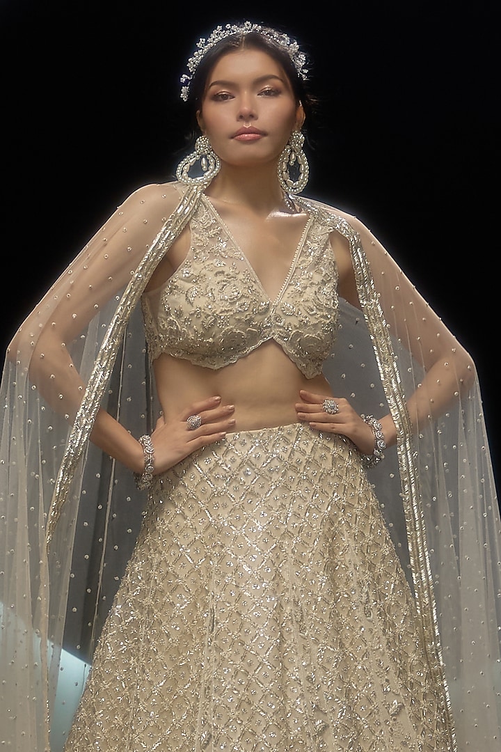 Ivory Net Hand & Machine Embroidered Bridal Lehenga Set by COUTURE BY NIHARIKA at Pernia's Pop Up Shop