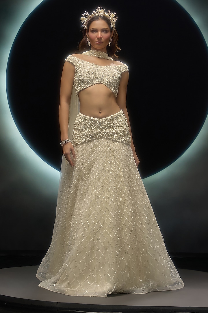 Ivory Net Embroidered Wedding Lehenga Set by COUTURE BY NIHARIKA at Pernia's Pop Up Shop
