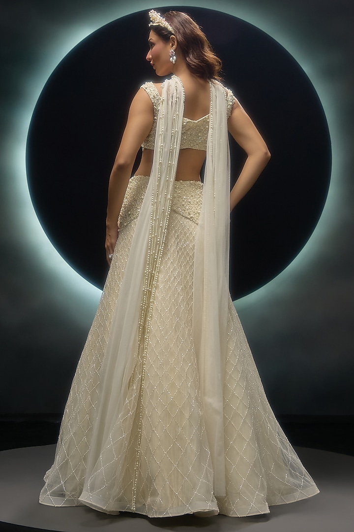 Ivory Net Embroidered Wedding Lehenga Set by COUTURE BY NIHARIKA at Pernia's Pop Up Shop