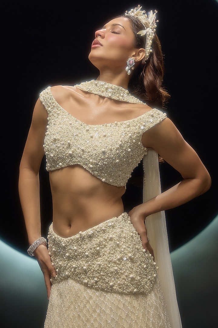 Ivory Net Embroidered Wedding Lehenga Set by COUTURE BY NIHARIKA at Pernia's Pop Up Shop