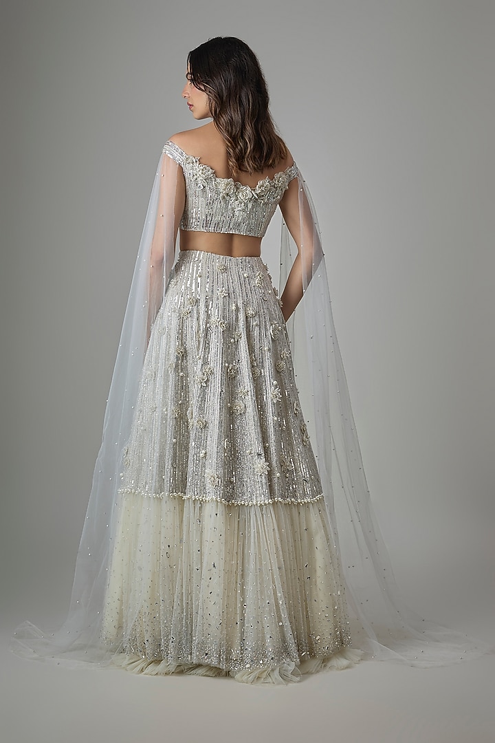 Ivory Net Sequin Hand Embroidered Bridal Lehenga Set by COUTURE BY NIHARIKA at Pernia's Pop Up Shop
