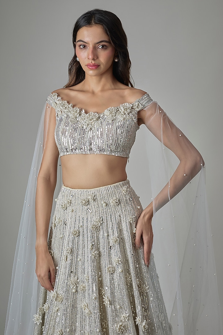 Ivory Net Sequin Hand Embroidered Bridal Lehenga Set by COUTURE BY NIHARIKA at Pernia's Pop Up Shop