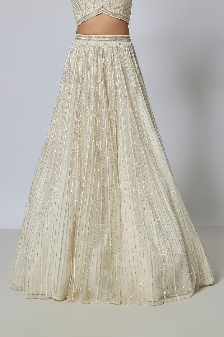 Ivory Net Sequins Embroidered Wedding Lehenga Set by COUTURE BY NIHARIKA at Pernia's Pop Up Shop