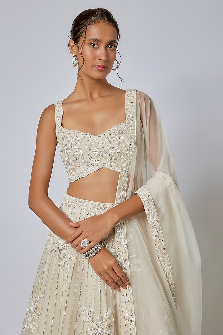Ivory Organza Cutdana Floral Embroidered Wedding Lehenga Set by COUTURE BY NIHARIKA at Pernia's Pop Up Shop