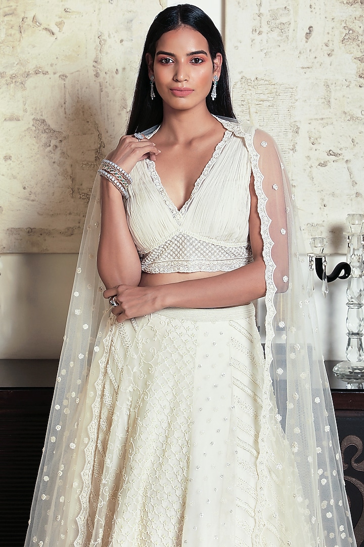Ivory Embroidered Bridal Lehenga Set by COUTURE BY NIHARIKA at Pernia's Pop Up Shop