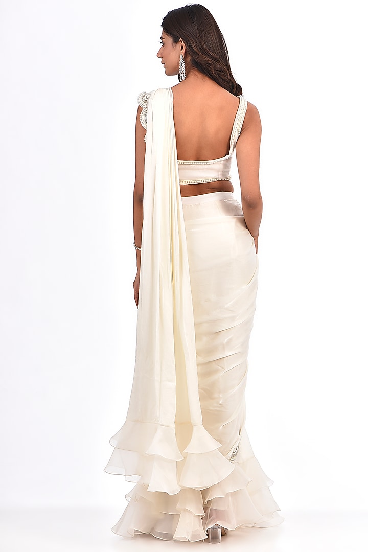 Ivory Satin Georgette Pearl Work Reception Saree Set by COUTURE BY NIHARIKA at Pernia's Pop Up Shop