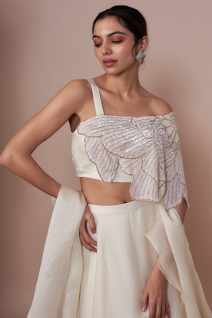 Ivory Satin Organza & Crepe A-Line Layered Wedding Lehenga Set by COUTURE BY NIHARIKA at Pernia's Pop Up Shop