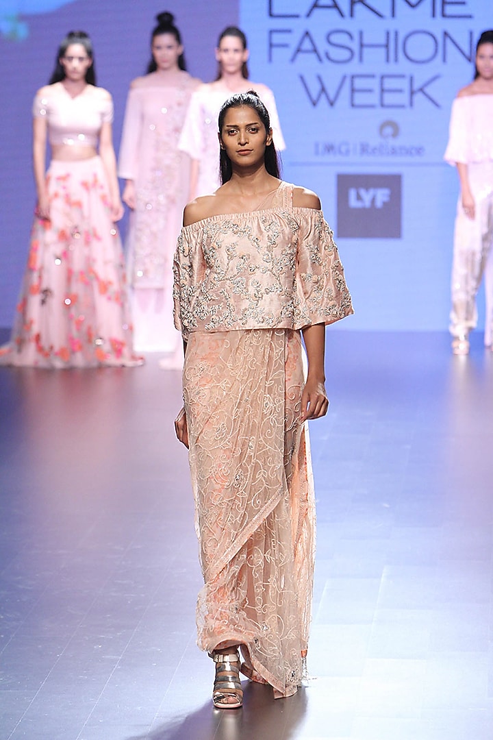 Pink sequins embroidered saree and off shoulder crop top with petticoat and potli bag available only at Pernia's Pop Up Shop.