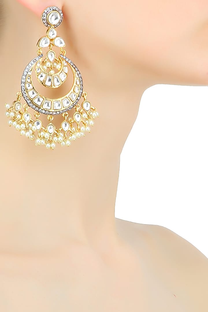 Nepra by Neha Goel presents Gold plated kundan and pearl coupled crescent earrings available only at Pernia's Pop Up Shop.