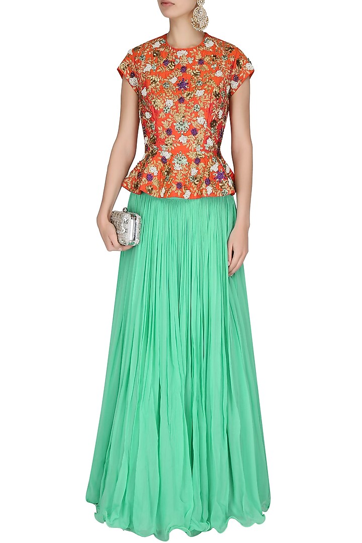 Coral jaal embroidered peplum top with sea green pleated skirt available only at Pernia's Pop Up Shop.