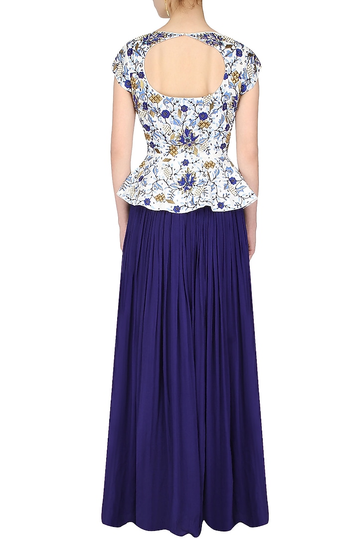 White embroidered peplum top with ink blue gathered skirt available only at Pernia's Pop Up Shop.