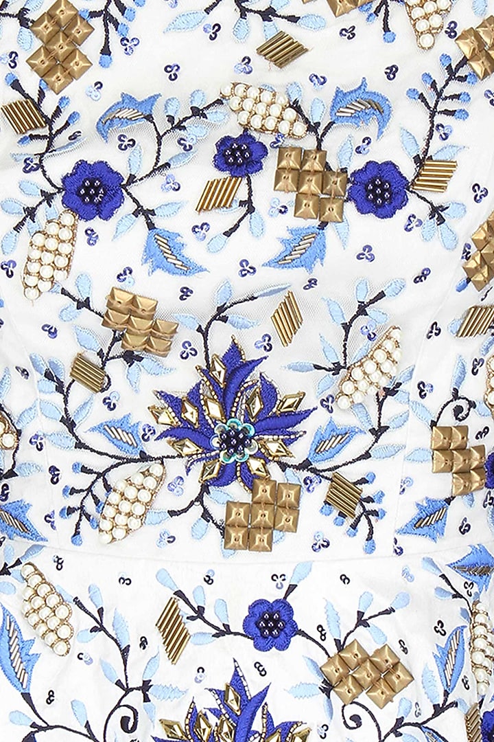 White embroidered peplum top with ink blue gathered skirt available only at Pernia's Pop Up Shop.