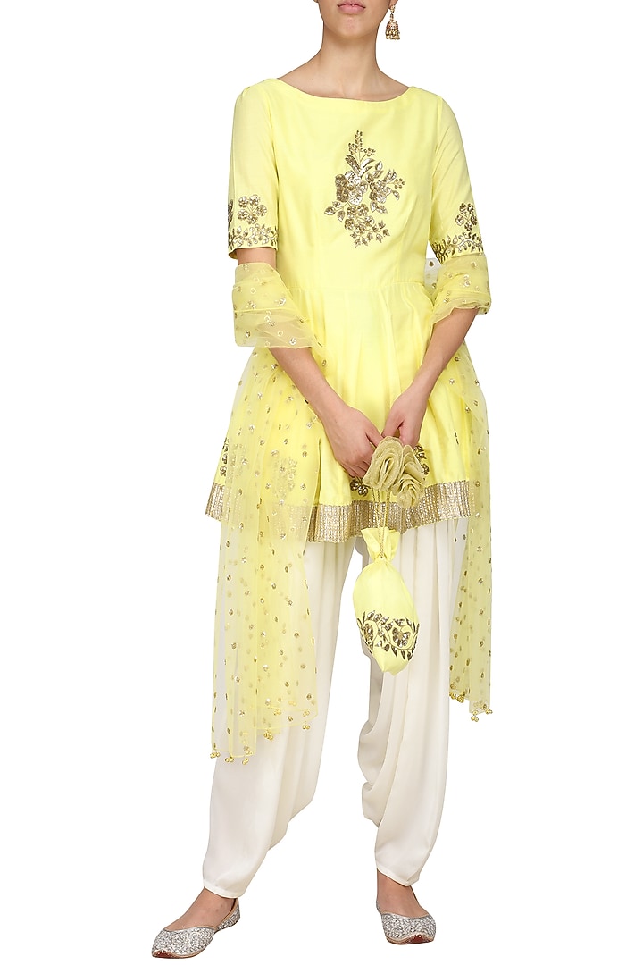 Yellow embroidered peplum kurta with ivory dhoti pants set available only at Pernia's Pop Up Shop.