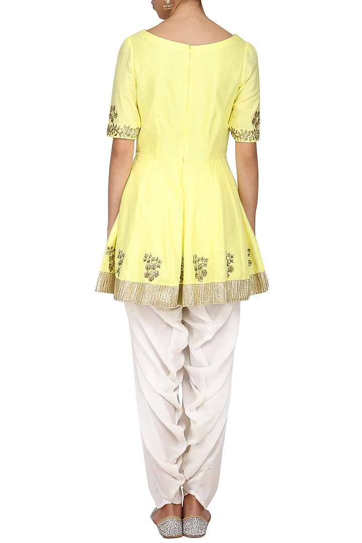 Yellow embroidered peplum kurta with ivory dhoti pants set available only at Pernia's Pop Up Shop.