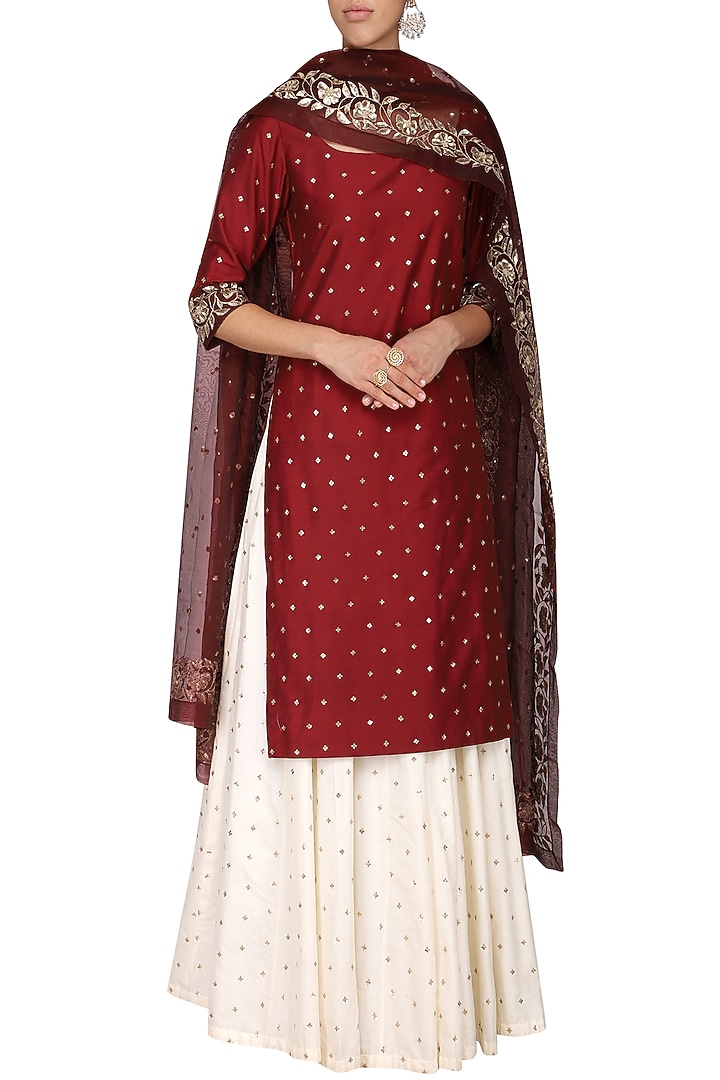 Wine embroidered kurta with ivory skirt set available only at Pernia's Pop Up Shop.