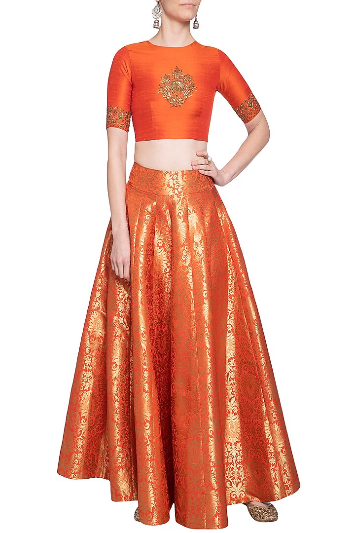 Orange embroidered crop top with lehenga skirt by Ranian at Pernia's Pop Up Shop