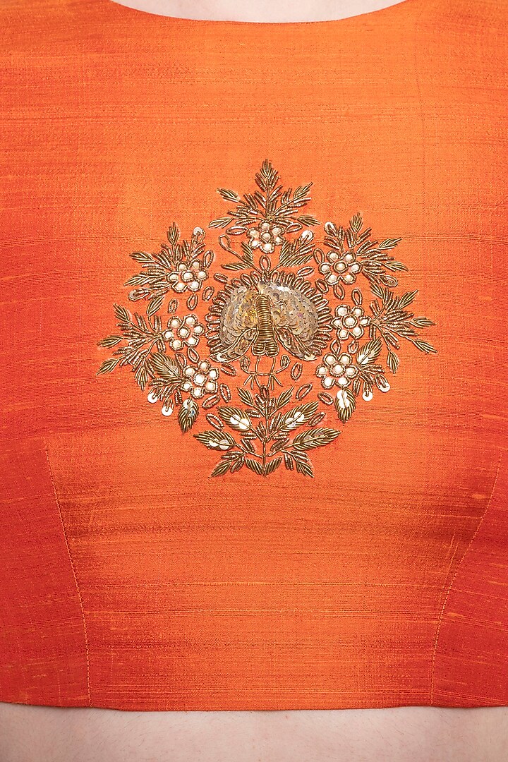 Orange embroidered crop top with lehenga skirt by Ranian at Pernia's Pop Up Shop