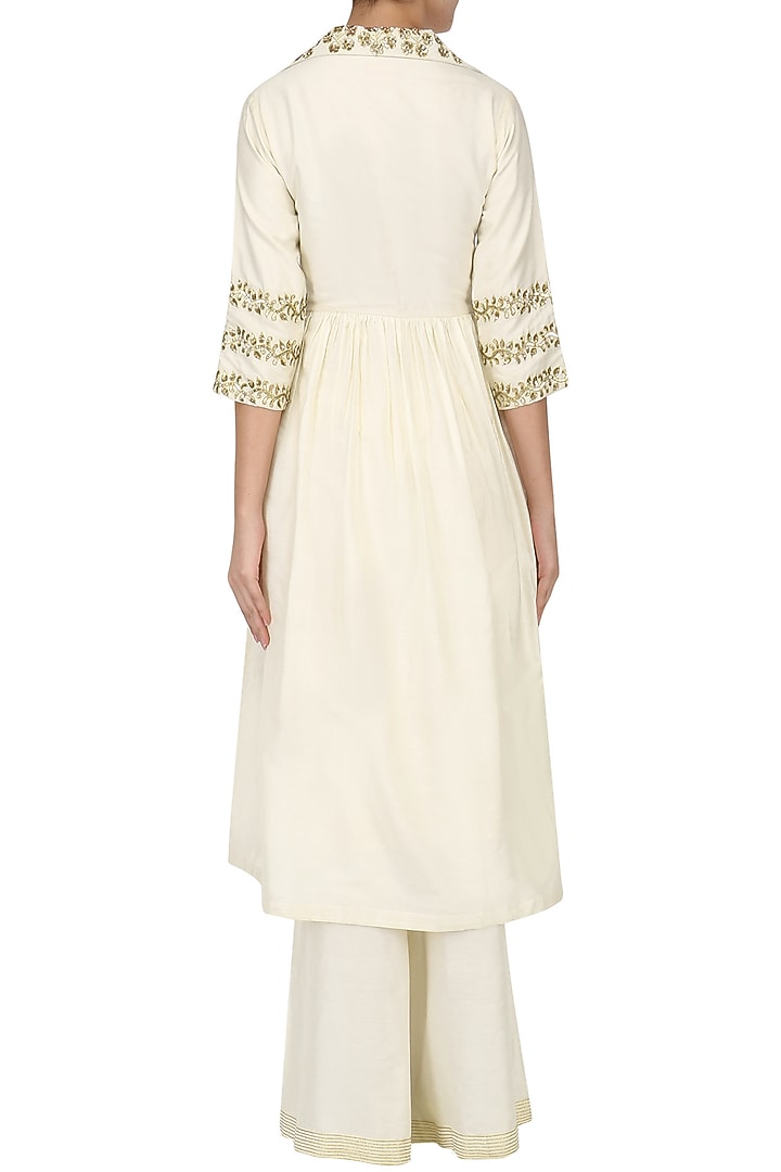 Ivory embroidered tunic with palazzo pants set available only at Pernia's Pop Up Shop.