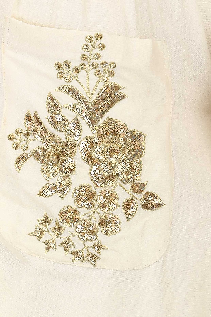 Ivory embroidered tunic with palazzo pants set available only at Pernia's Pop Up Shop.