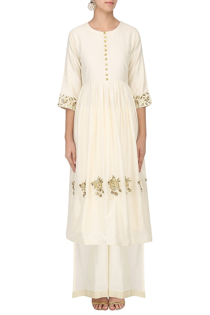 Ivory embroidered tunic with palazzo pants set available only at Pernia's Pop Up Shop.