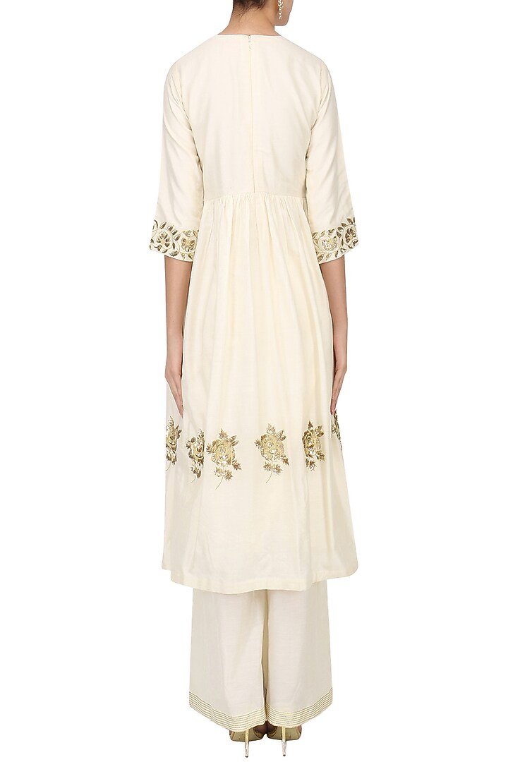 Ivory embroidered tunic with palazzo pants set available only at Pernia's Pop Up Shop.