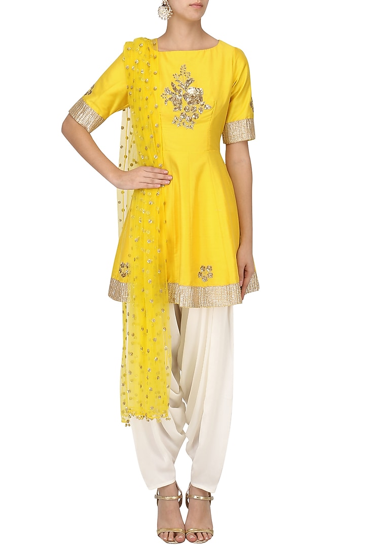 Sunflower yellow embroidered peplum kurta with dhoti salwar set available only at Pernia's Pop Up Shop.