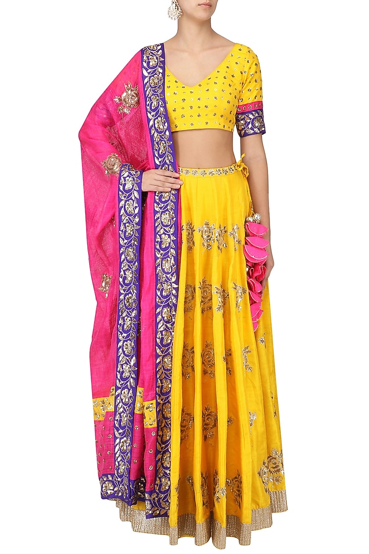 Turmeric yellow and pink embroidered lehenga set available only at Pernia's Pop Up Shop.