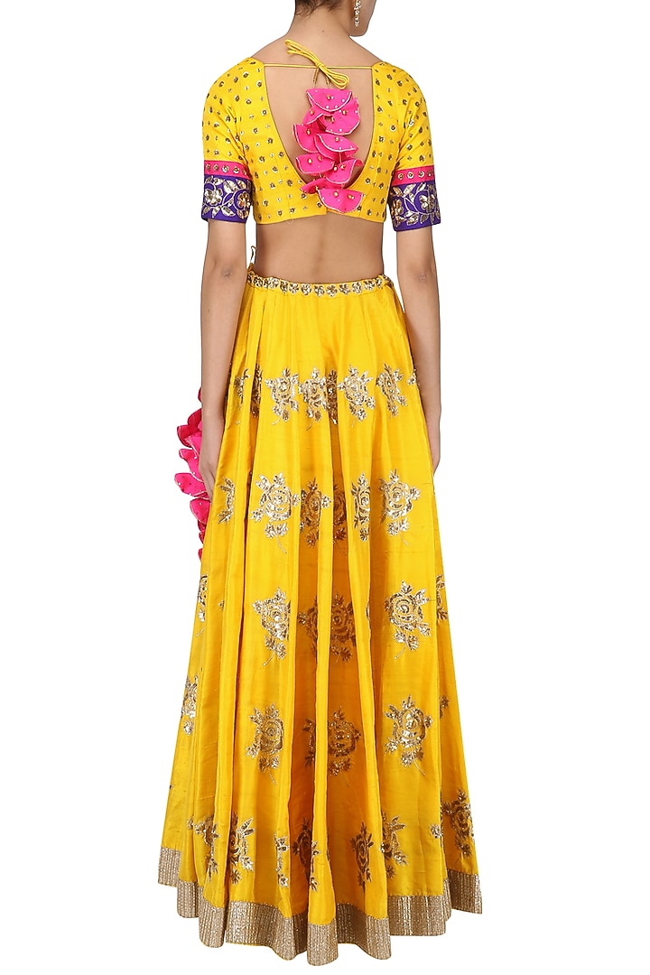 Turmeric yellow and pink embroidered lehenga set available only at Pernia's Pop Up Shop.