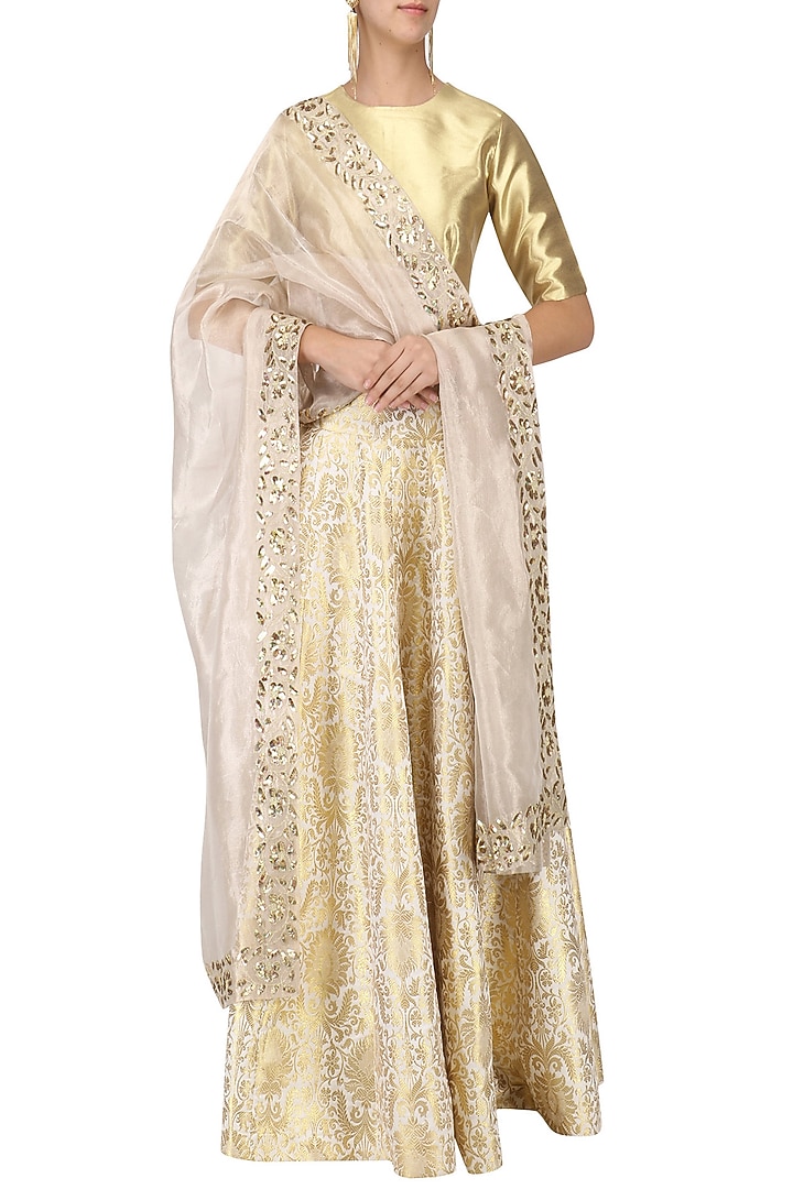 Gold zari brocade lehenga set available only at Pernia's Pop Up Shop.