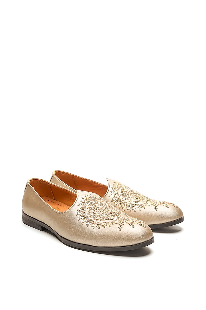 Light Gold Leather Embroidered Mojaris by NIDHI BHANDARI MEN at Pernia's Pop Up Shop