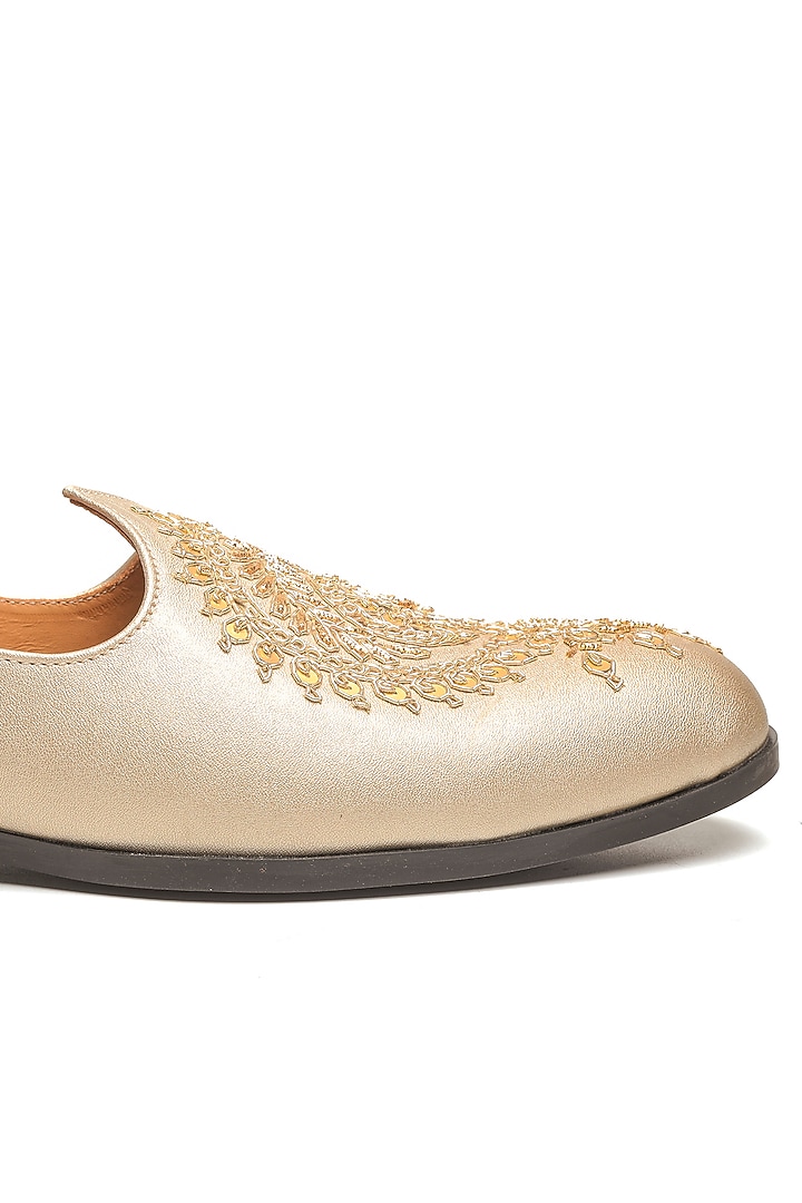 Light Gold Leather Embroidered Mojaris by NIDHI BHANDARI MEN at Pernia's Pop Up Shop