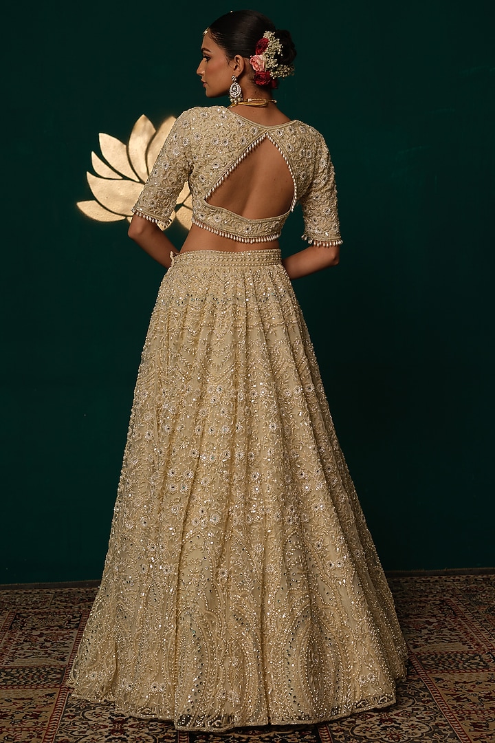 Cream Net Floral & Cutdana Hand Embroidered Bridal Lehenga Set by Niloufer by Aasif Ally at Pernia's Pop Up Shop