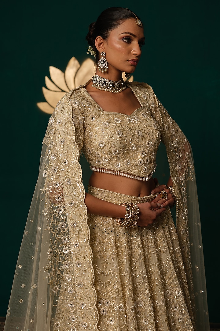 Cream Net Floral & Cutdana Hand Embroidered Bridal Lehenga Set by Niloufer by Aasif Ally at Pernia's Pop Up Shop