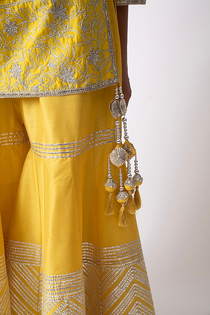 Yellow Banarasi Katan Nakshi Gota Embellished Gharara Set by Nia By Sonia Ahuja at Pernia's Pop Up Shop