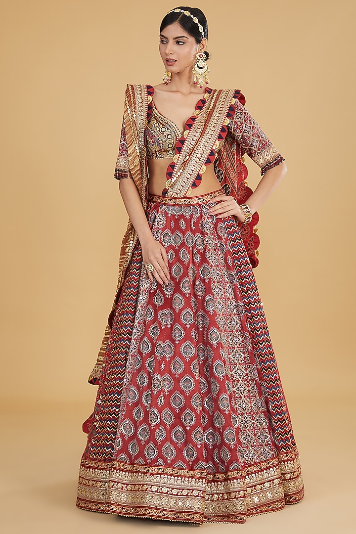 Maroon Modal Silk Ajrakh Printed & Embroidered Bridal Lehenga Set by Nitya Bajaj at Pernia's Pop Up Shop