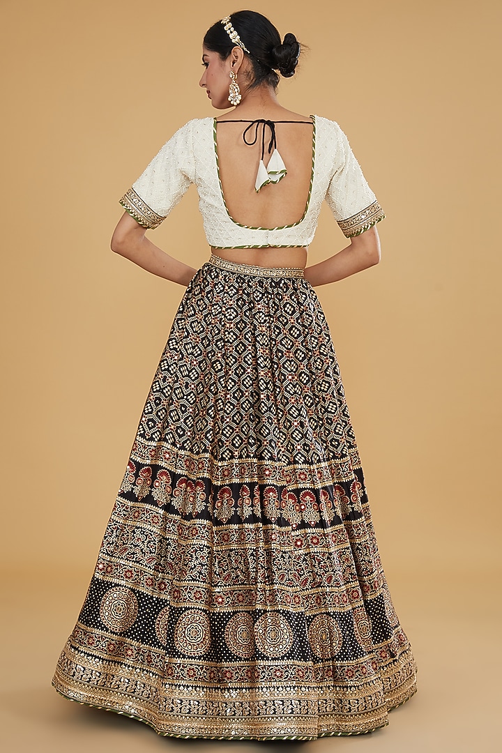 Black Modal Silk Ajrakh Printed & Embroidered Wedding Lehenga Set by Nitya Bajaj at Pernia's Pop Up Shop
