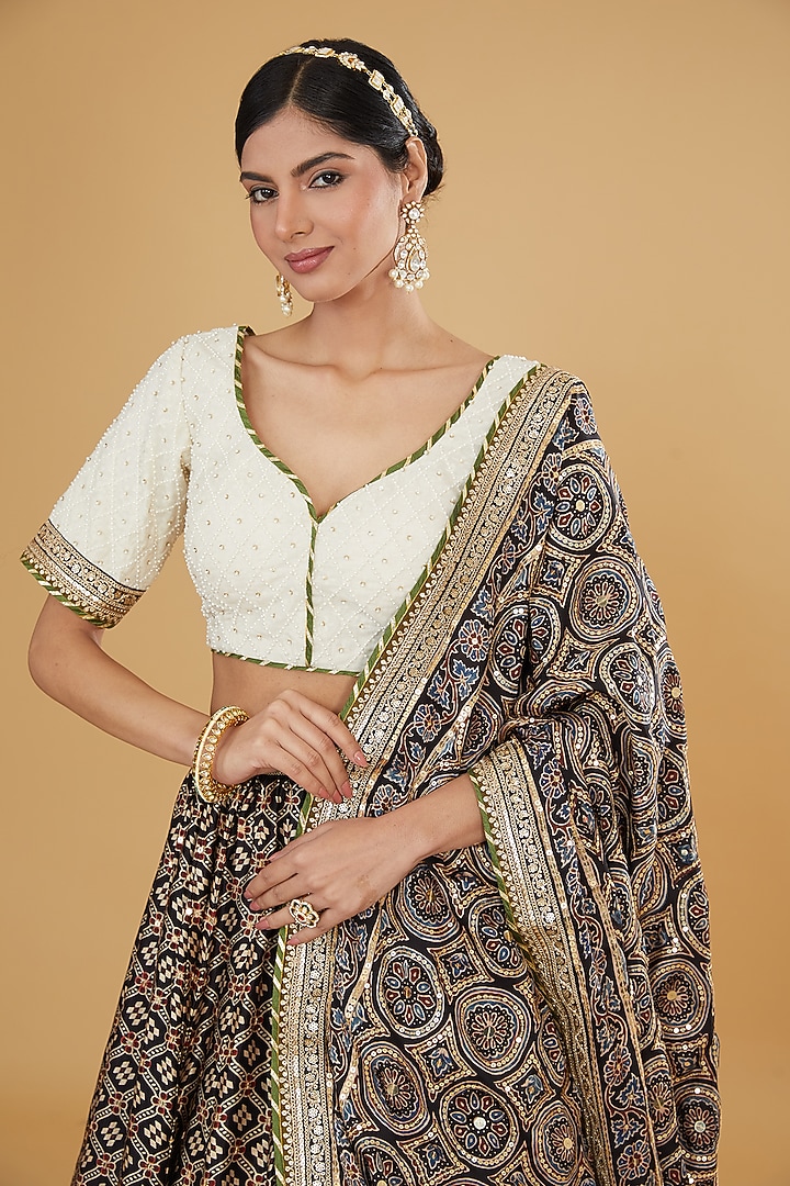 Black Modal Silk Ajrakh Printed & Embroidered Wedding Lehenga Set by Nitya Bajaj at Pernia's Pop Up Shop