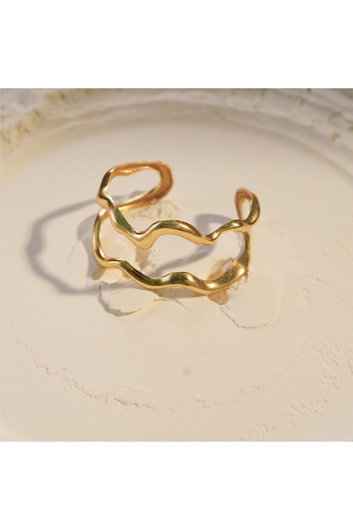 Gold Finish Handcrafted Ripple Handcuff by NIHIRAA INDIA at Pernia's Pop Up Shop