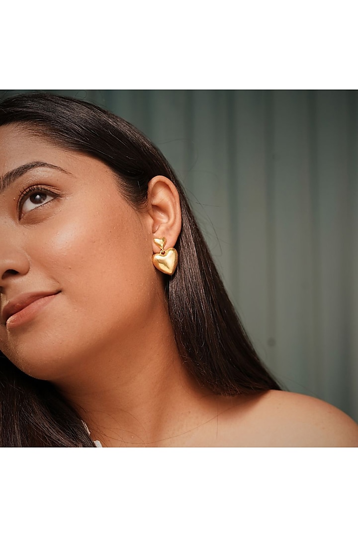 Gold Finish Heart Dangler Earrings by NIHIRAA INDIA at Pernia's Pop Up Shop