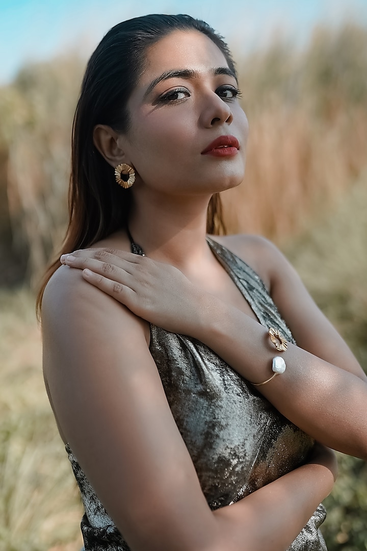 Gold Finish Pearl Handcrafted Stud Earrings With Cuff by NIHIRAA INDIA at Pernia's Pop Up Shop