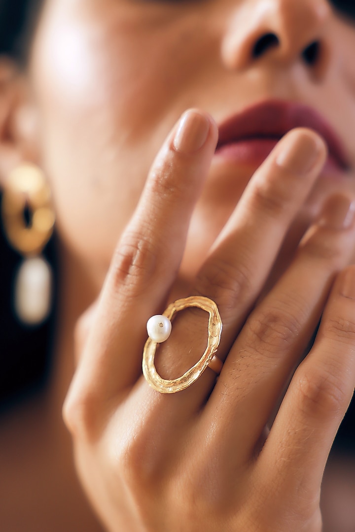 Gold Finish Pearl Handcrafted Dangler Earrings With Ring by NIHIRAA INDIA at Pernia's Pop Up Shop