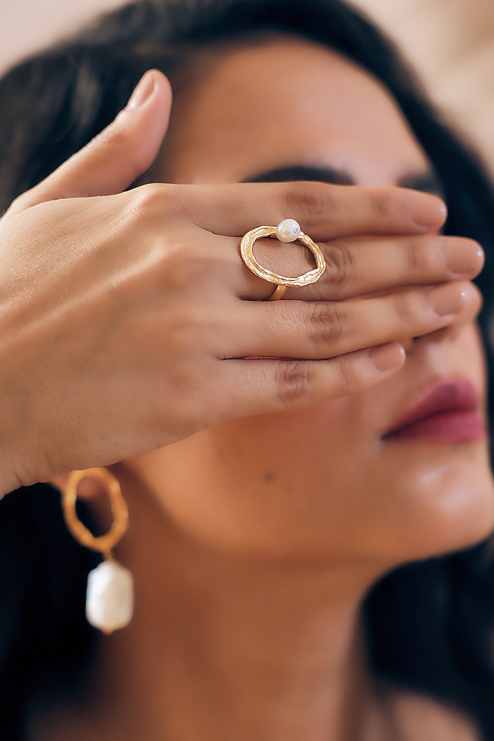 Gold Finish Pearl Handcrafted Dangler Earrings With Ring by NIHIRAA INDIA at Pernia's Pop Up Shop