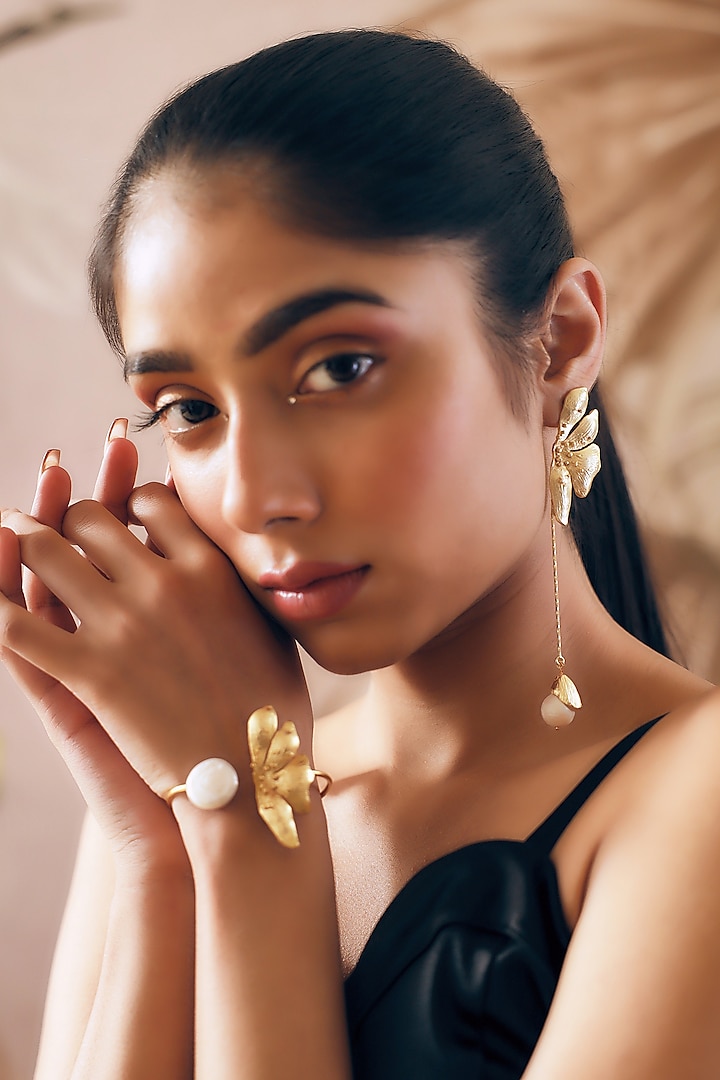 Gold Finish Pearl Handcrafted Dangler Earrings With Cuff by NIHIRAA INDIA at Pernia's Pop Up Shop